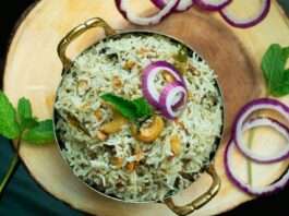 a plate of rice with onions and onions