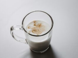 clear glass mug with white liquid