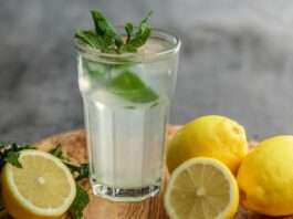 lime juice on drinking glass beside sliced limes